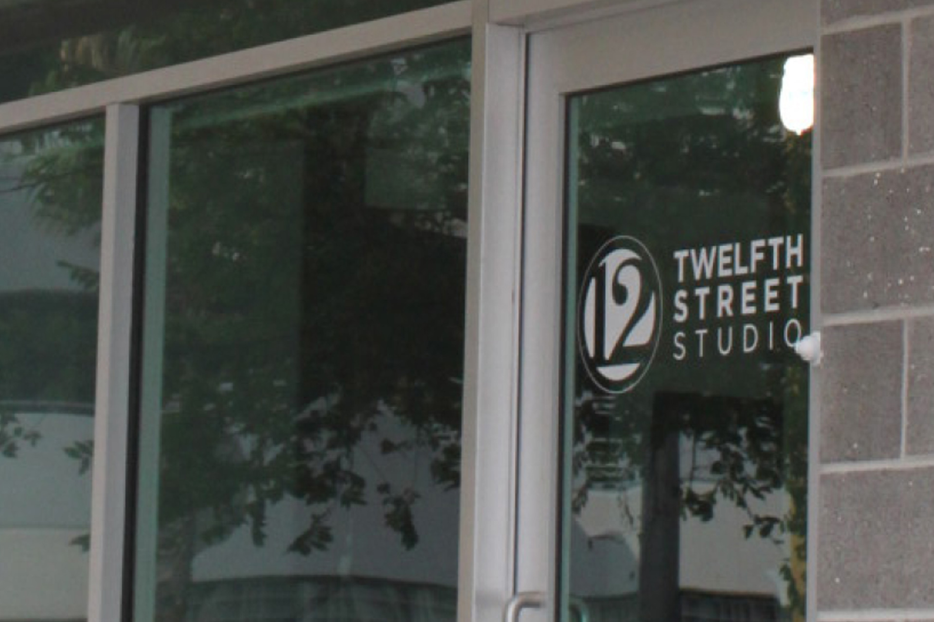 One-color logo variant appearing on the office's front door